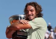 Stefanos Tsitsipas hugs the trophy at the 2022 Rolex Monte-Carlo Masters